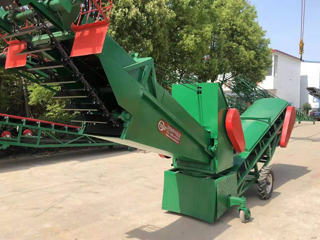  Side view of mobile multi-function grain loading scraper
